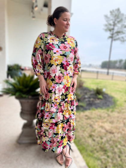 From the button down yoke accented by a dainty ruffle around the neckline as well as the sleeve. Drop shoulders gives it a slight oversized feel running a bit generous. 